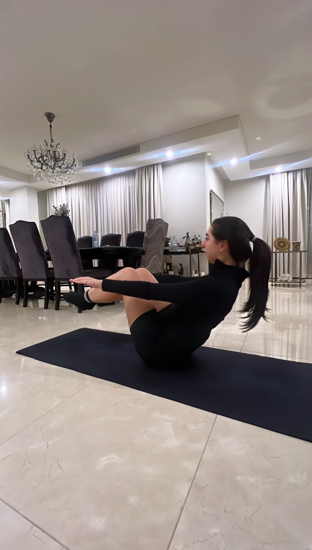 woman practising Pilates at home showing the long-term benefits of Pilates
