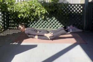 woman practising low impact Pilates workout at home for strength and wellness