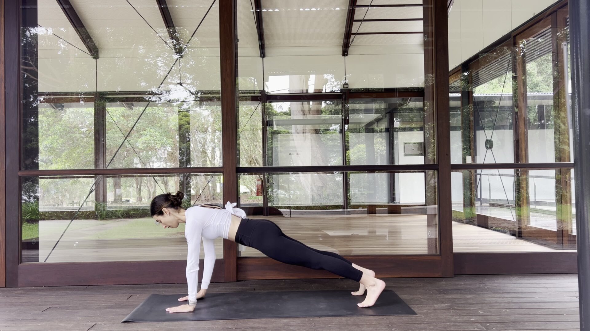woman with the pilates girl look standing tall with confident posture and glowing calm energy
