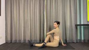 woman doing pilates classes online at home