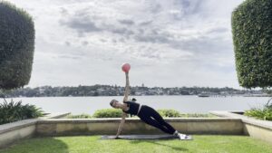 beginner doing pilates at home on a mat in a calm space